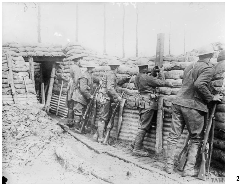 Canadian 1st Division, Ploegsteert, March 20, 1916 after the Canadians had been issued with steel helmets. This photo gives an idea of trench conditions. Note the soldier second from right using a trench periscope.