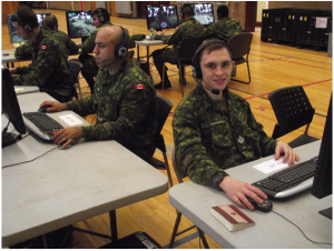 Cpl Cortes and MCpl Tarabanko filling their positions in an offensive operation on the VBS-2 system during The Royal Montreal Regiments exercise in late November 2015. Photo: Capt M.J. Szostak, RMR UPAR.