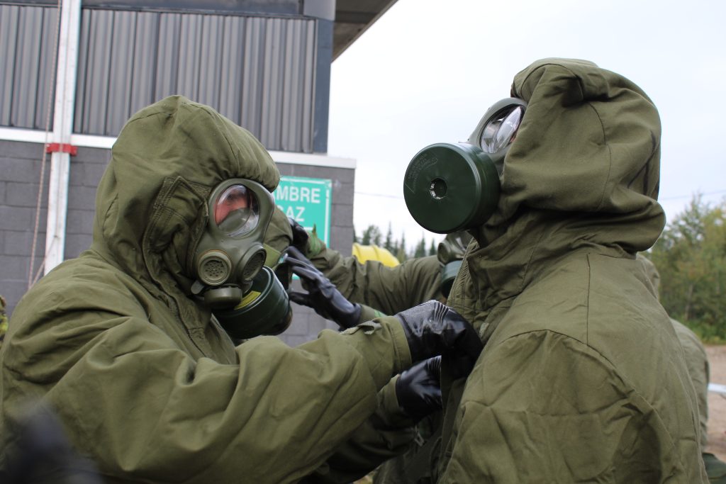 RMR soldiers checking their CBRN equipment outside of the gas hut on Exercise RENEWED VIGOR in 2013